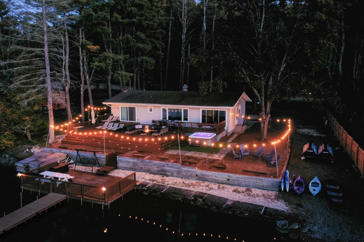 Lakehouse deck and string lights at night